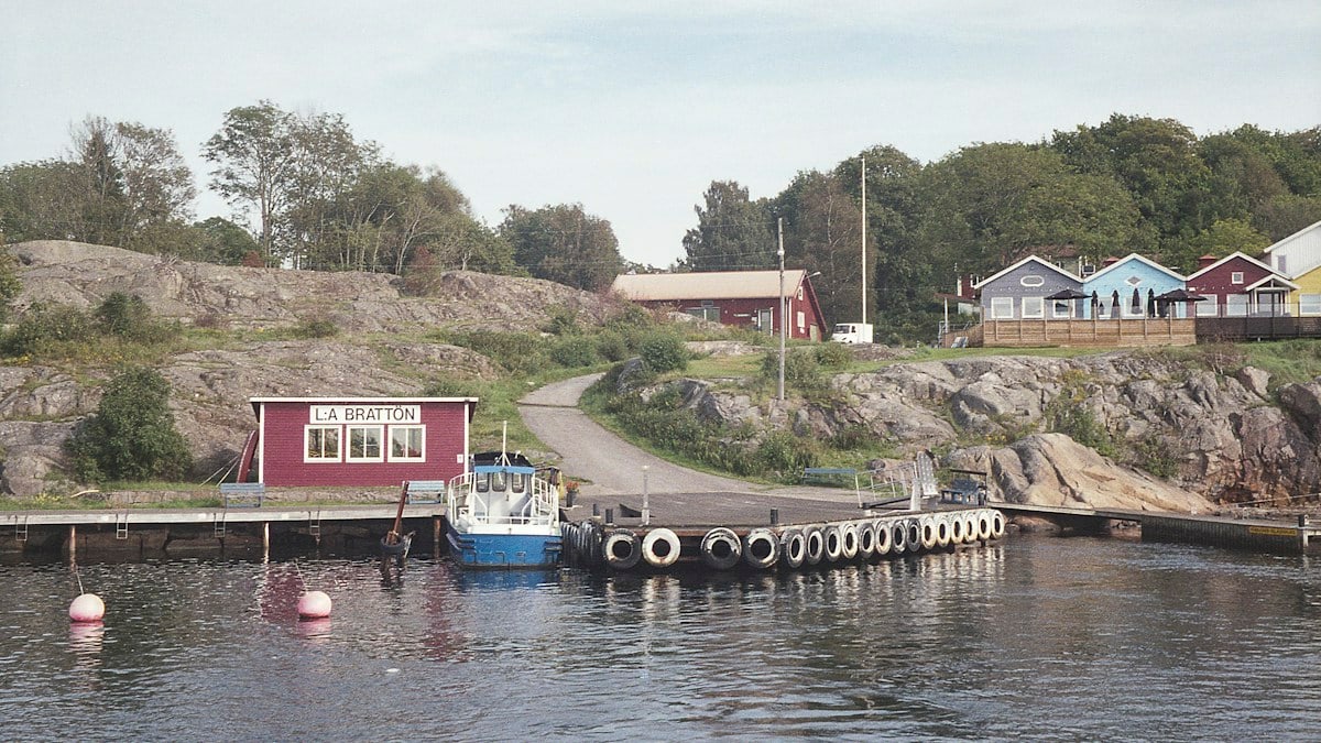 a boat is docked at a dock in the water